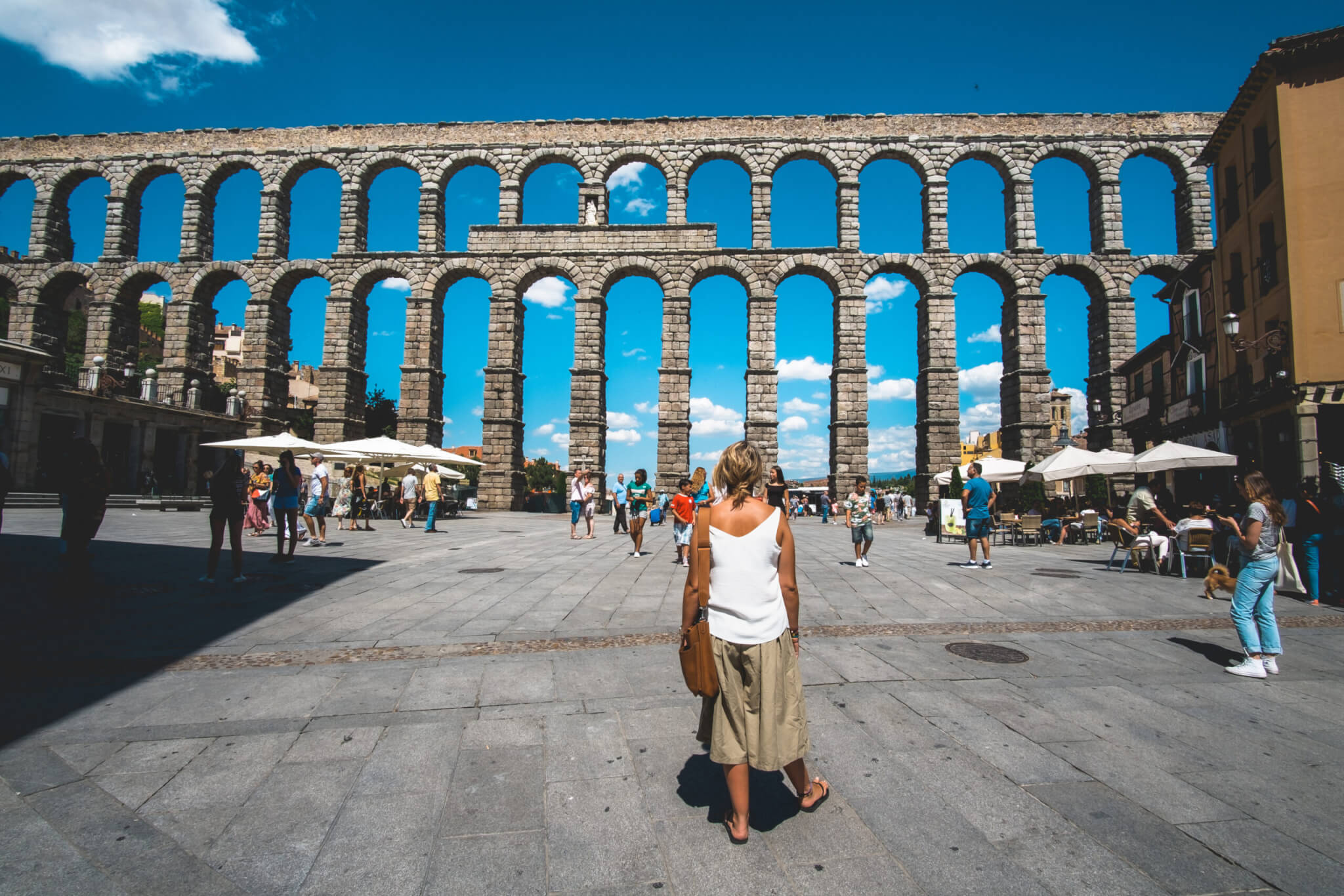 Tourists visits the aqueduct in segovia spain