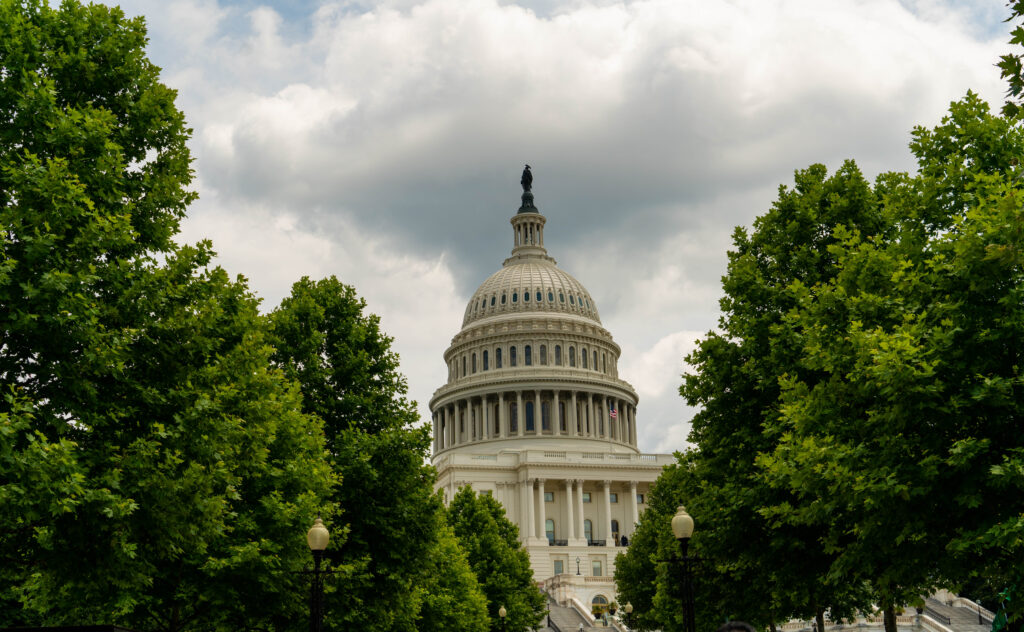 United states capitol dome behind trees