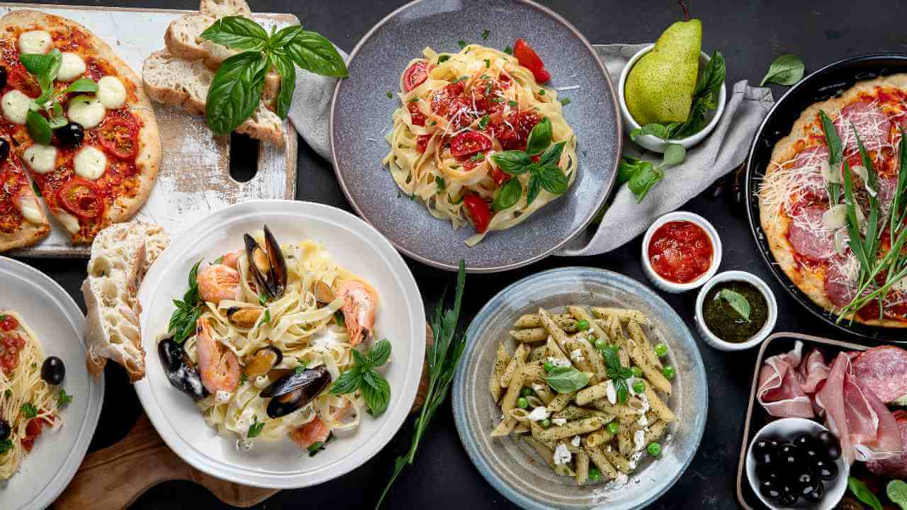various types of italian food on a table