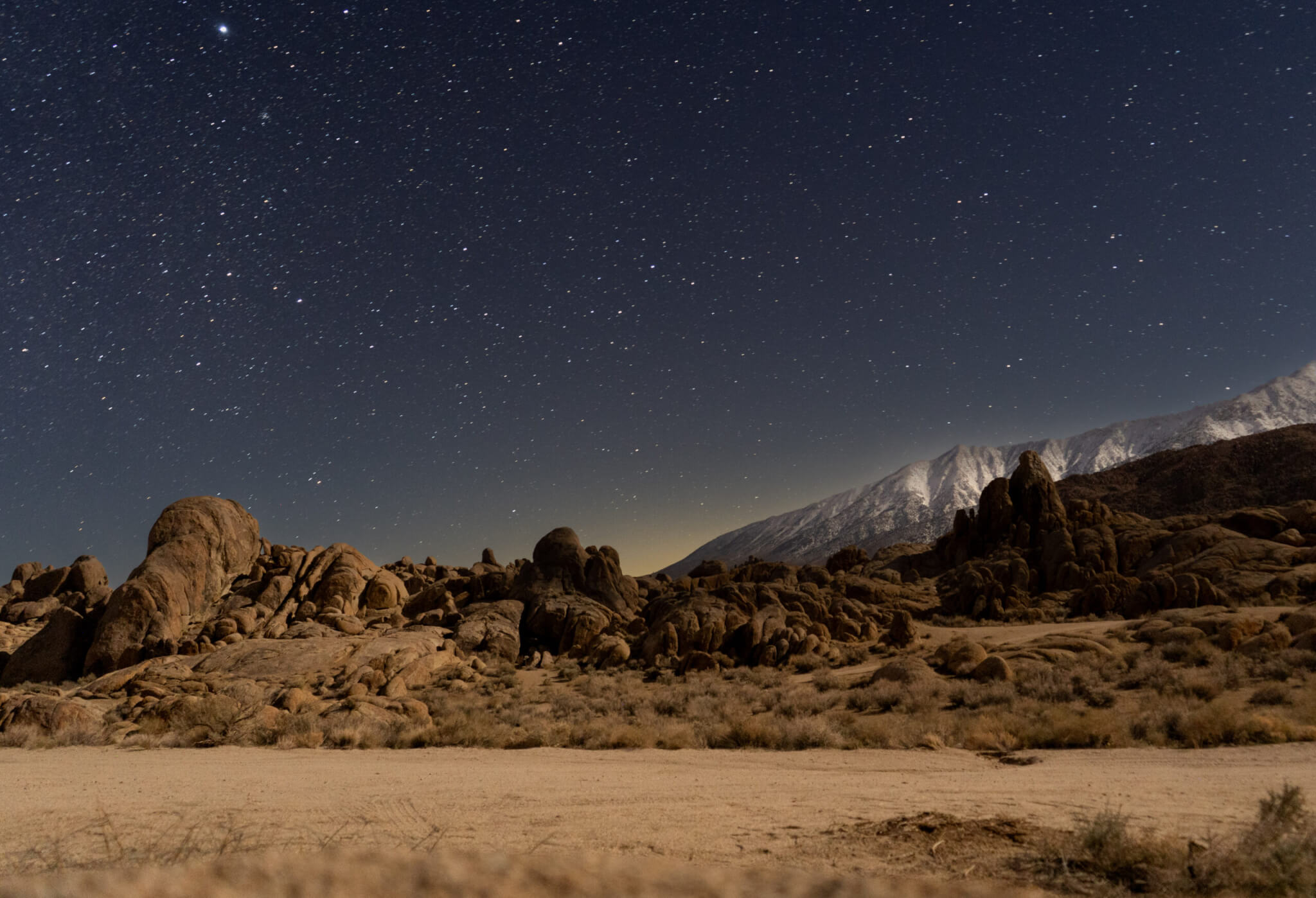 Brown rocks under starry sky