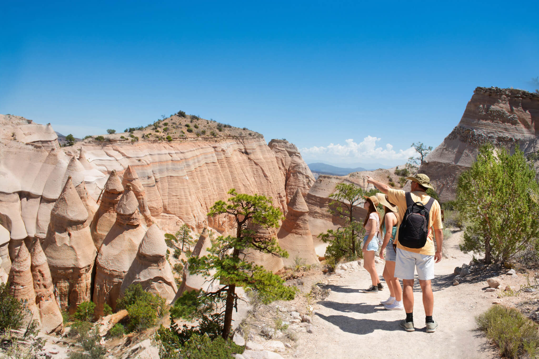 Family on hiking on vacation in beautiful mountains. Kasha-Katuwe Tent Rocks National Monument, Close to of Santa Fe, New Mexico, USA