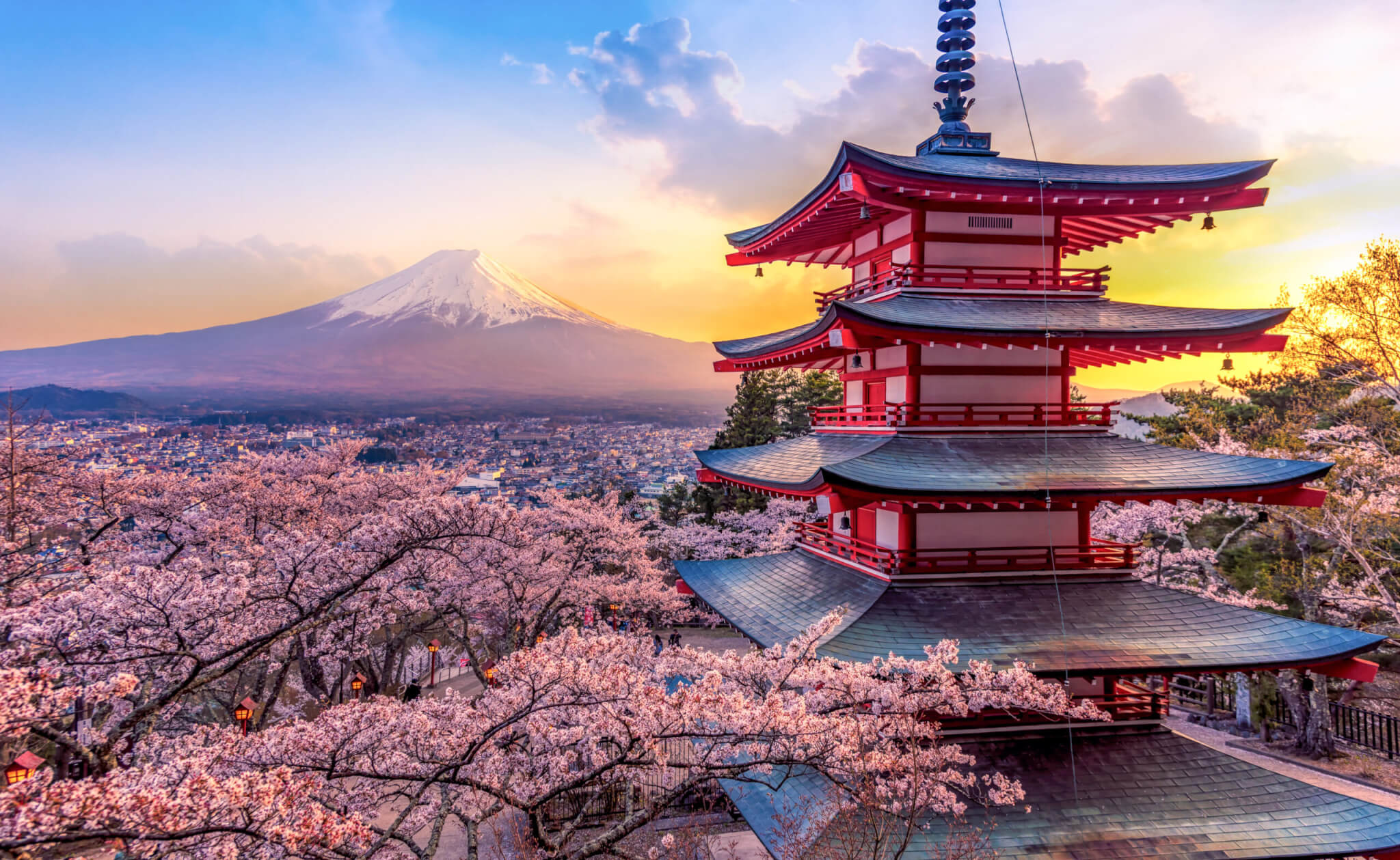 Fujiyoshida, Japan Beautiful view of mountain Fuji and Chureito pagoda at sunset, japan in the spring with cherry blossoms