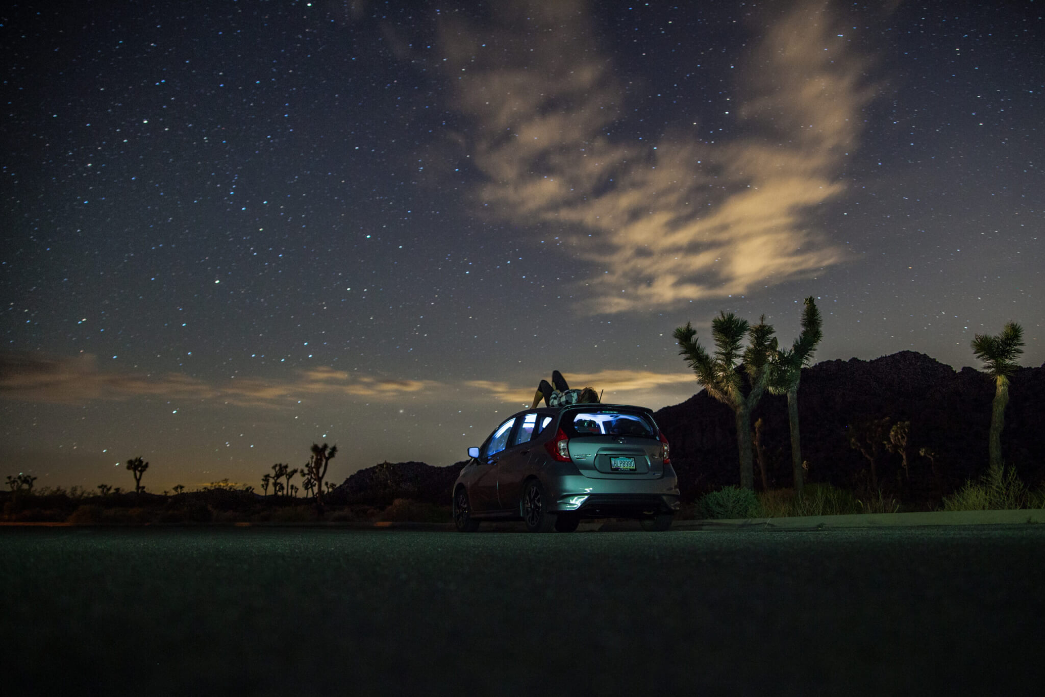 Gray suv under blue starry sky during nighttime