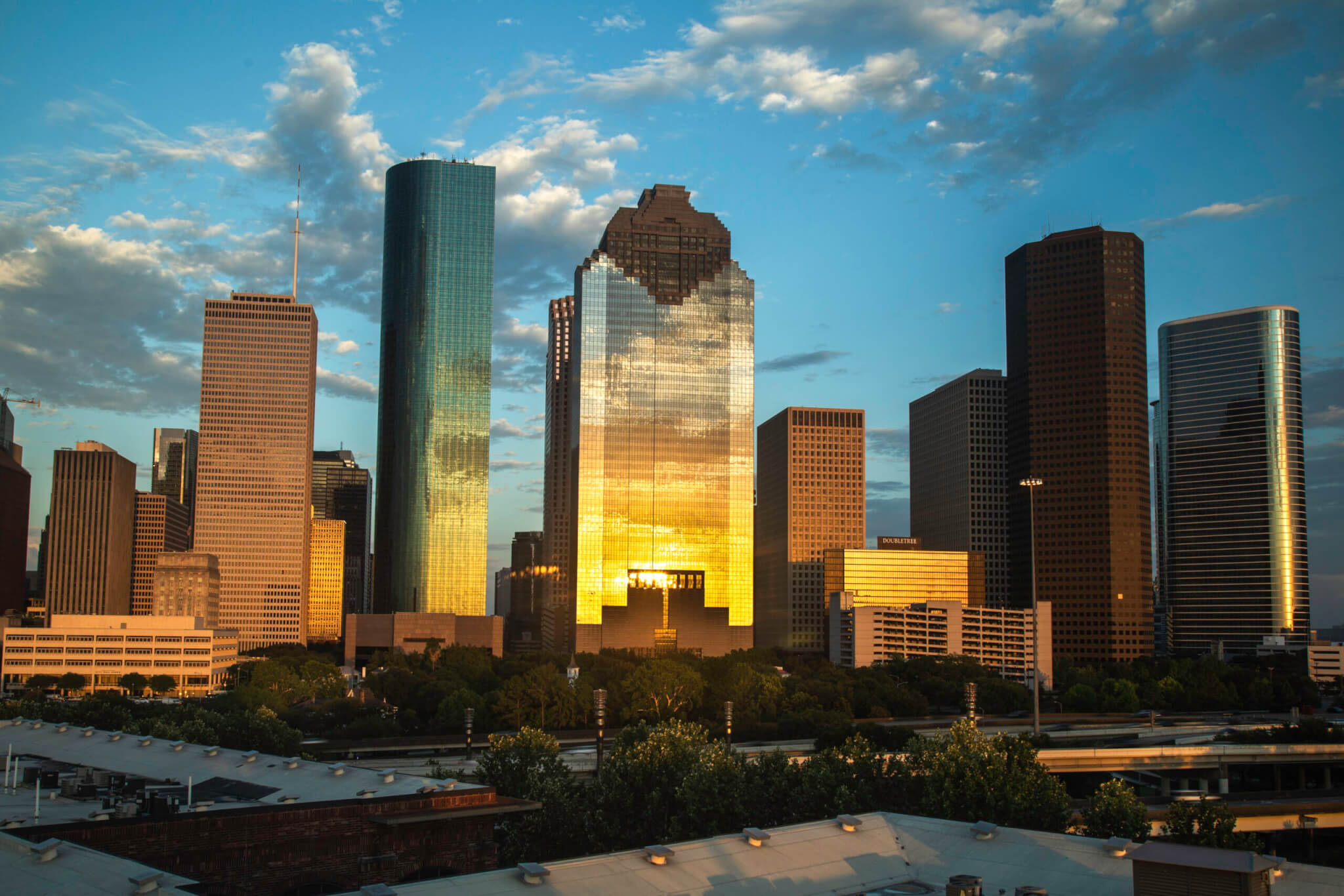 High rise buildings in the city under the cloudy sky