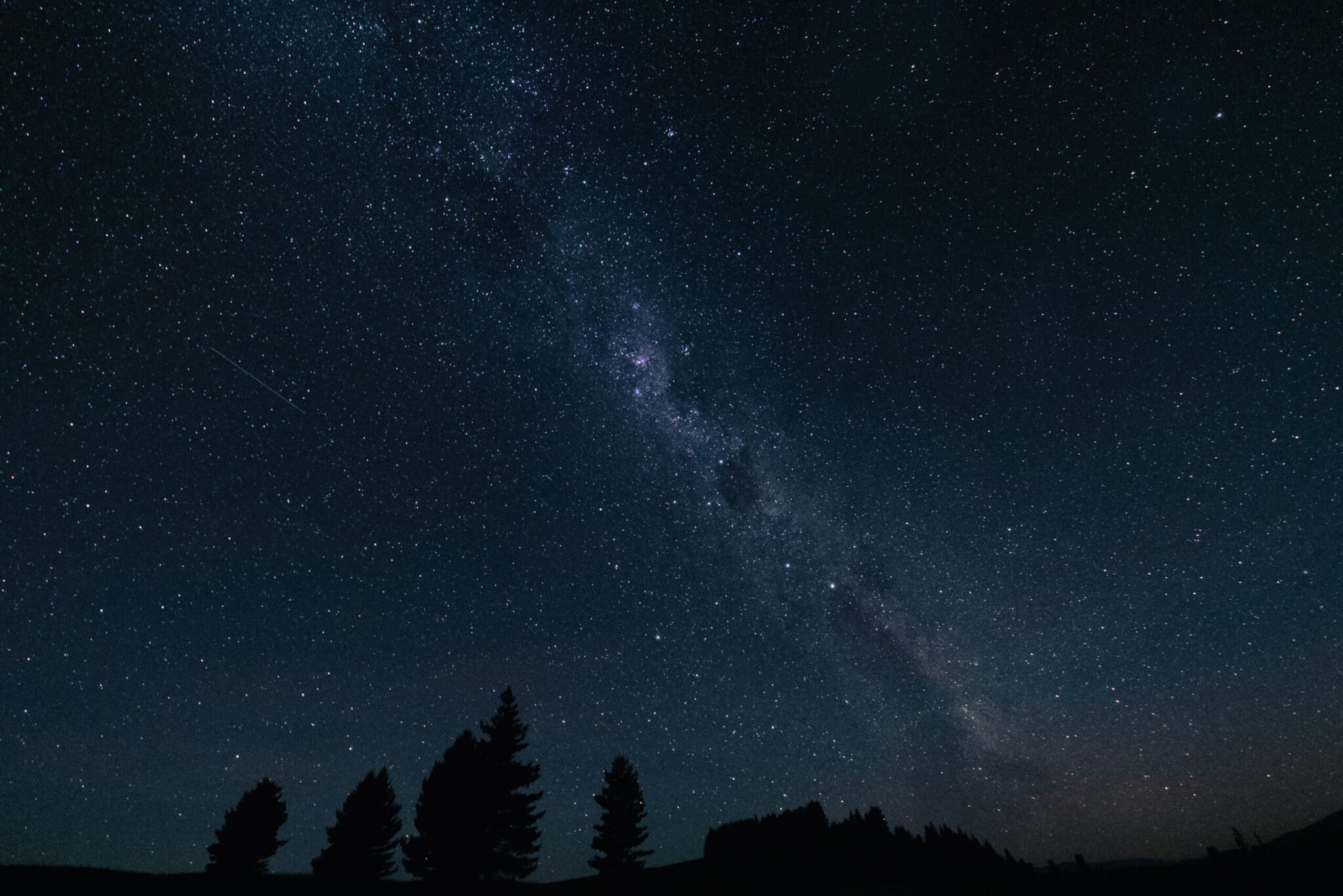 Milky way in the dark night sky and stars, Aoraki Mount Cook National Park, South Island, New Zealand.