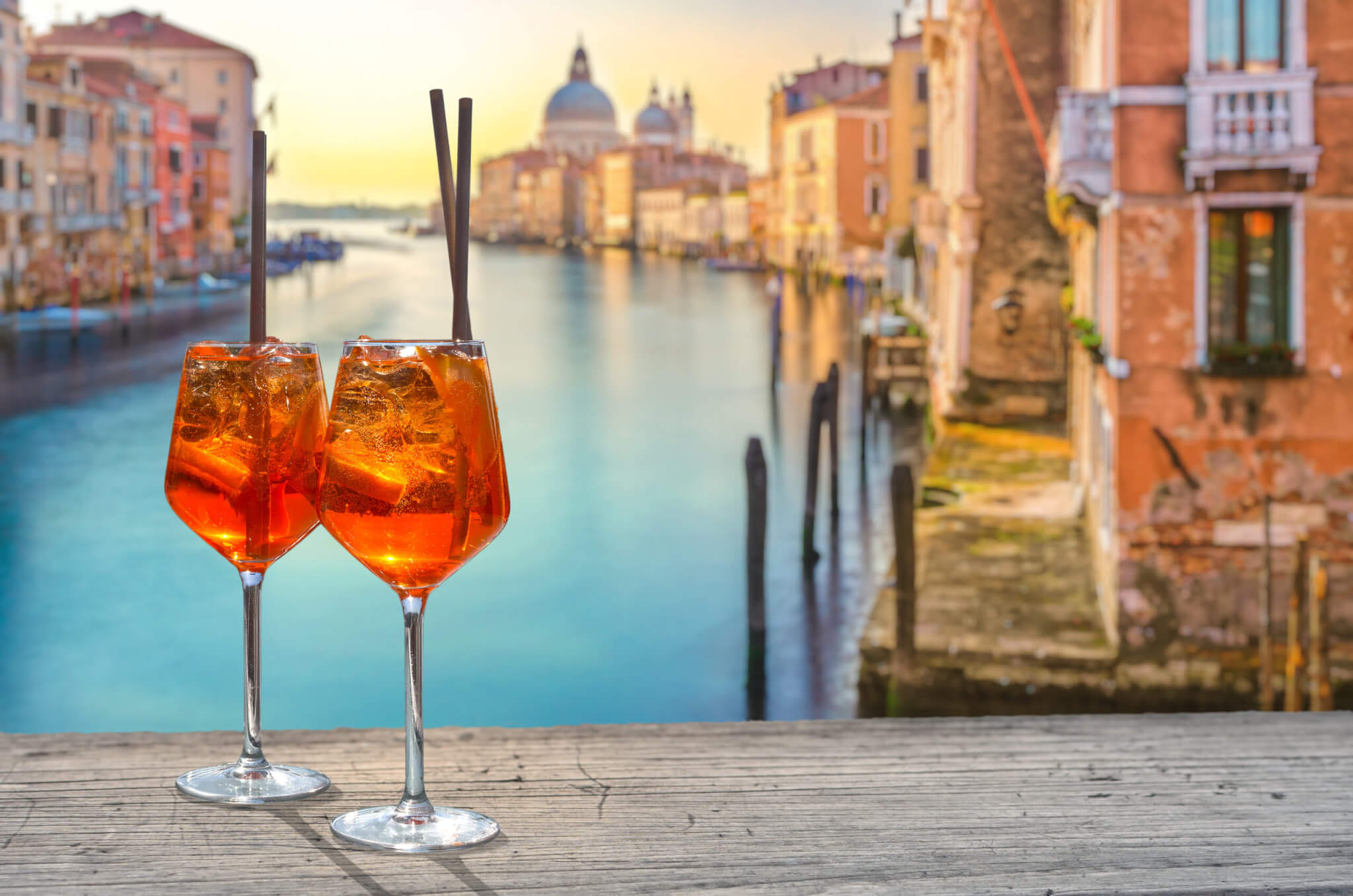 two Aperol Spritz in Venice, in the background the view from the Accademia Bridge