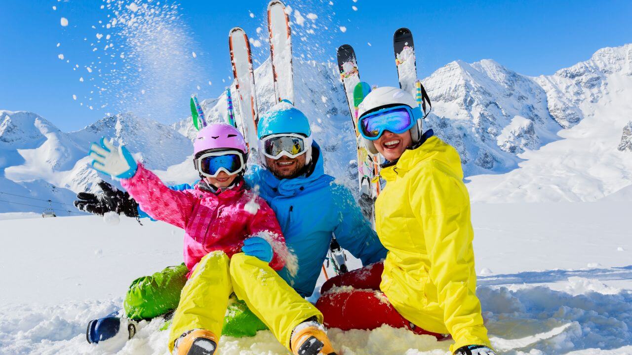 Family enjoying skiing together at a North American mountain resort