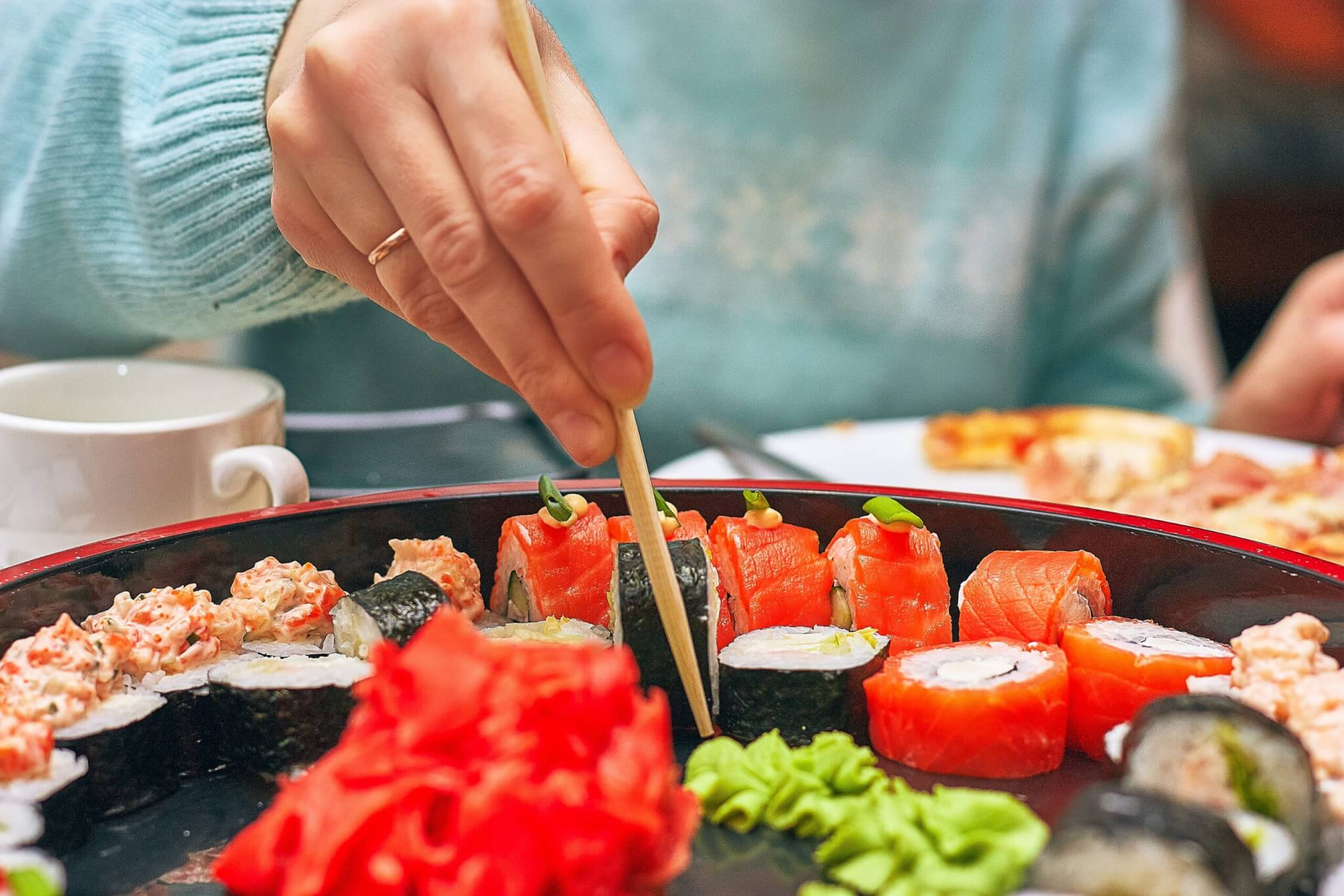 Close up of person eating sushi