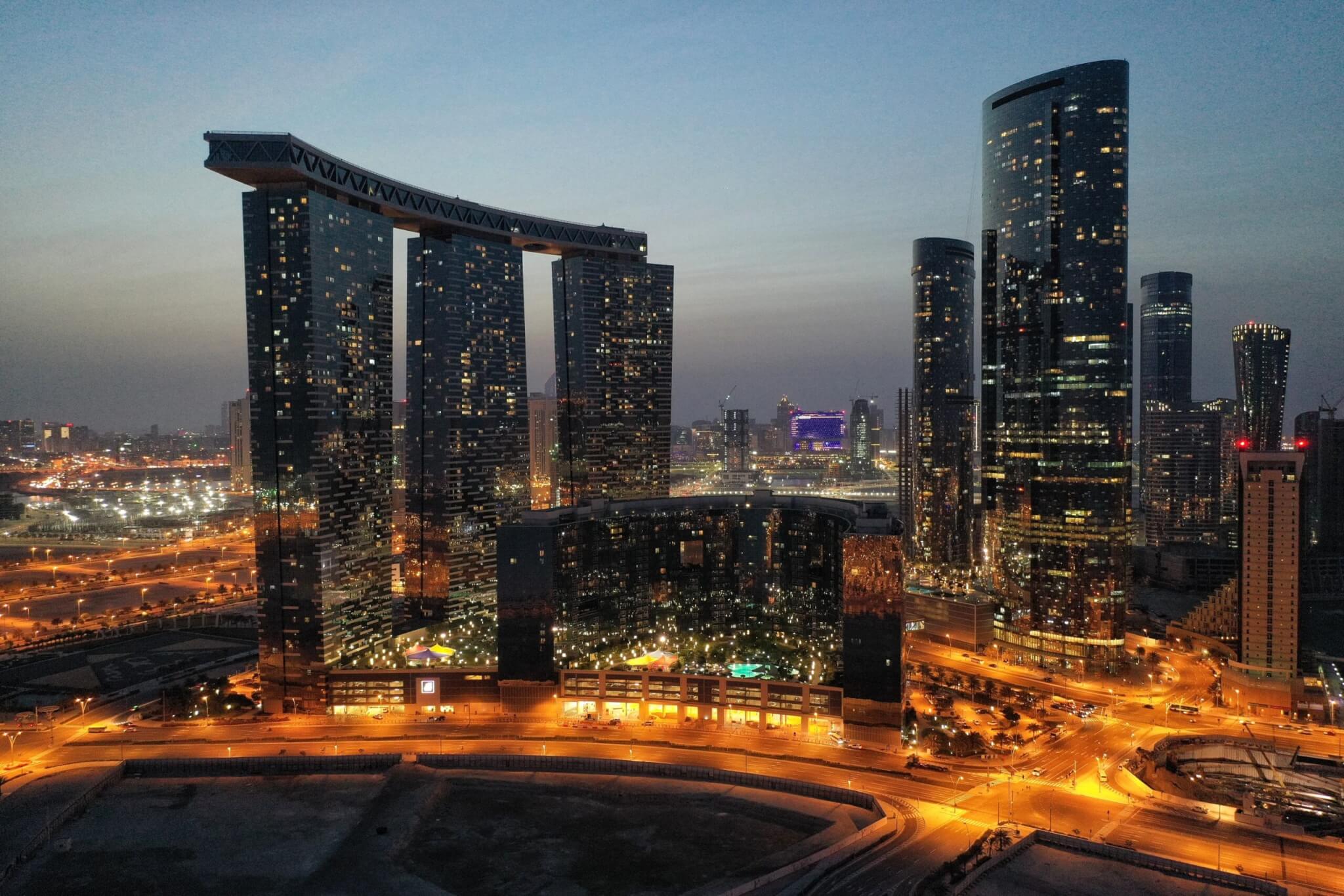 Iconic Al Reem Island buildings, Gate Towers, The Arc, The Sun Tower and The Sky Tower, seen at sunset