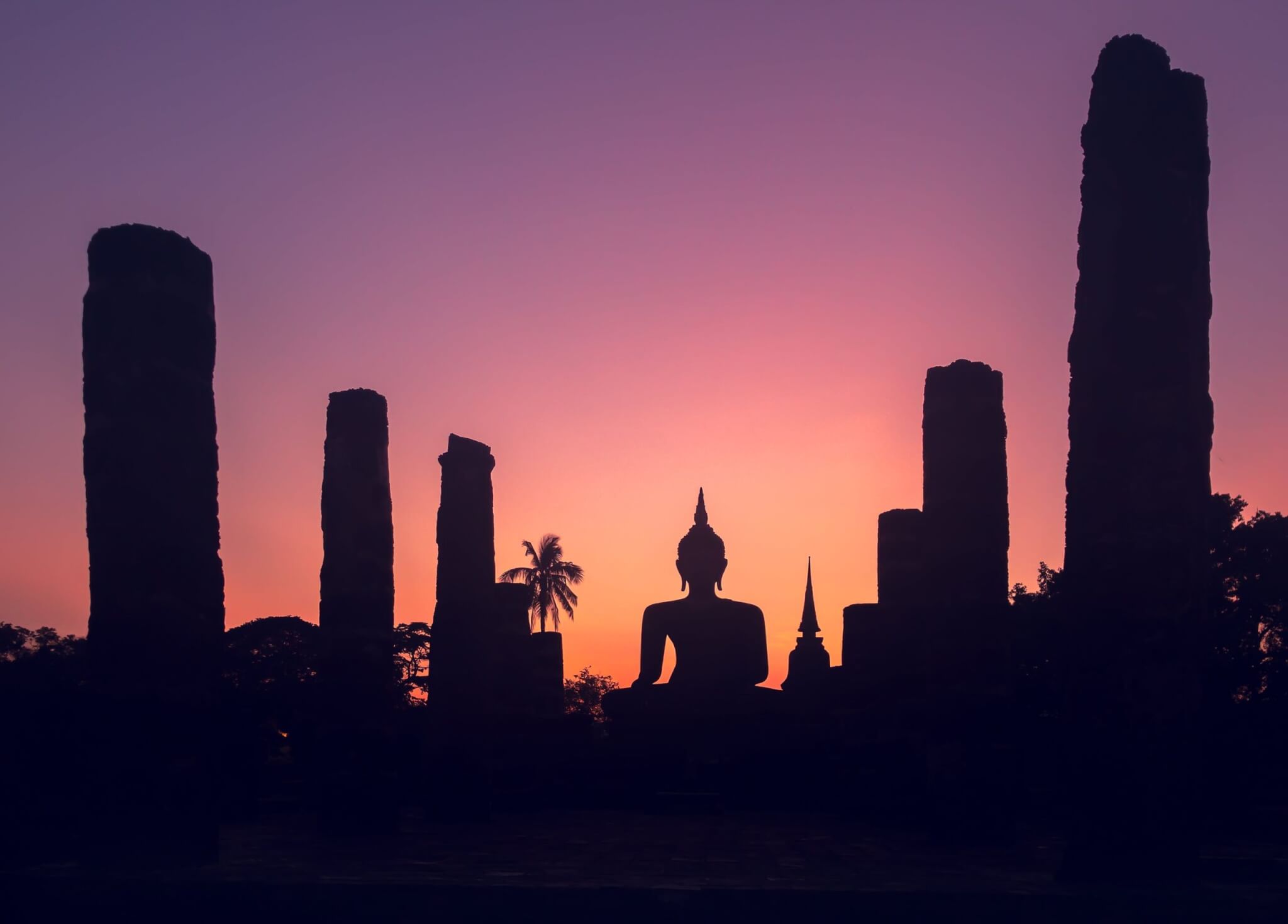 Majestic sunset sky over big buddha statue