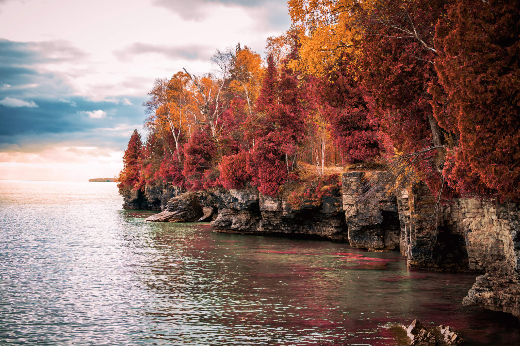 Red and orange trees on the coastal cliffs of Door County, Wisconsin USA.