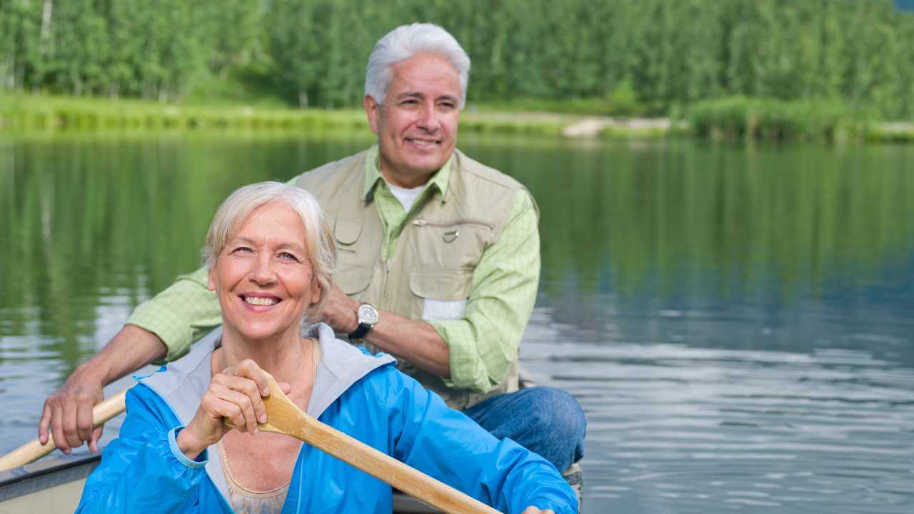 A couple in a canoe on a lake