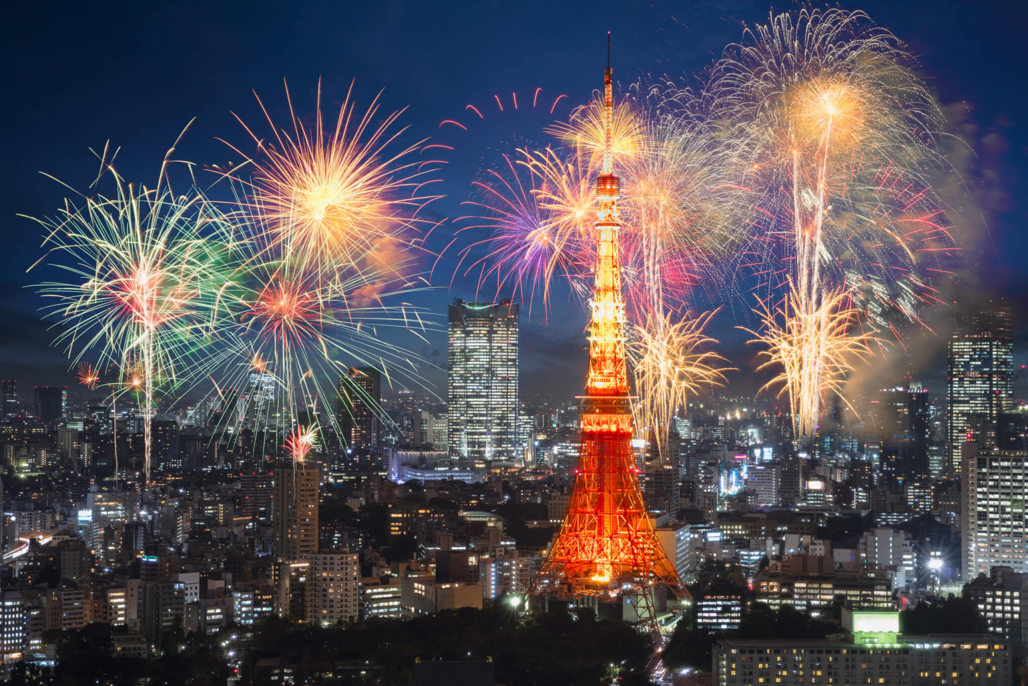 Fireworks celebrating over tokyo cityscape at night, Tokyo Japan