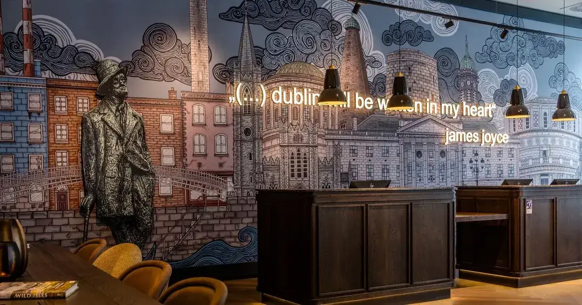 Unique design of a hotel lobby in Dublin, this hotel integrated Dublin's art and beauty in a mural behind the front desks