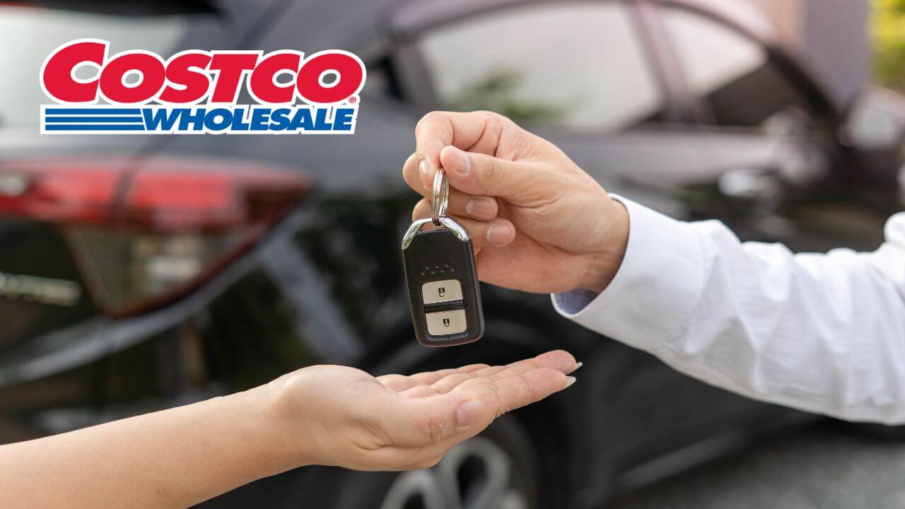 costco brand with rental car worker handing over keys to the person who rented the car
