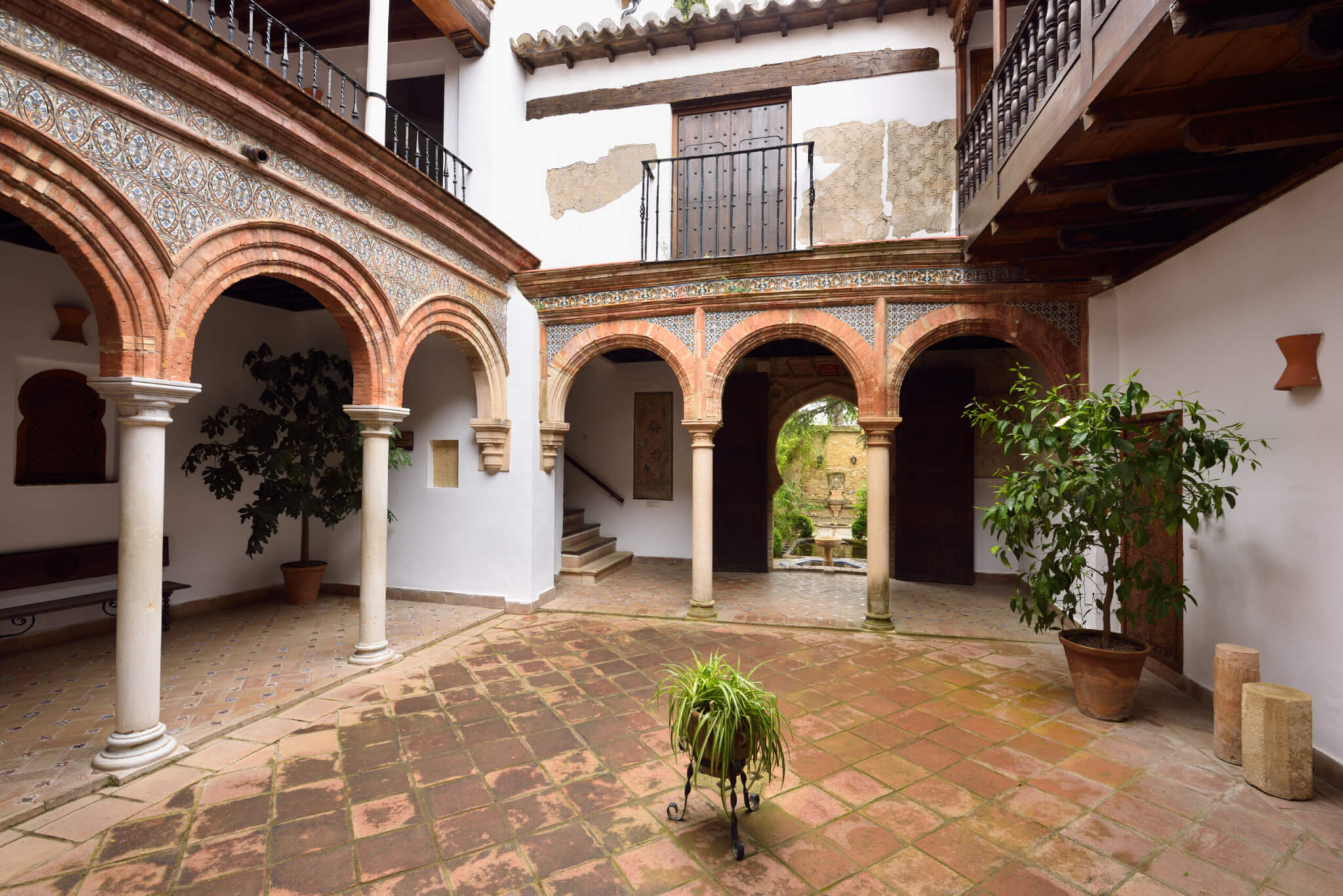 Mudejar design in open courtyard at Mondragon Moorish Palace and Ronda Museum Andalusia Spain
