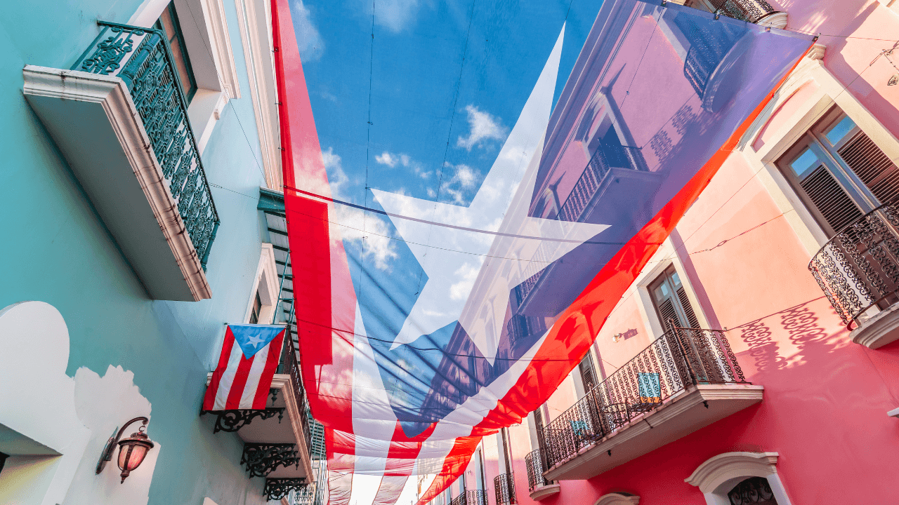 flag of puerto rico hung between buildings