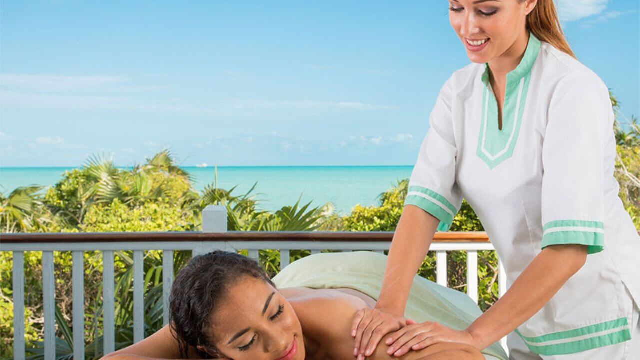woman getting a massage ocean front at the shore club