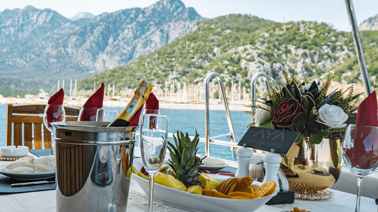 luxury cruise dining experience with beautiful mountains in the background