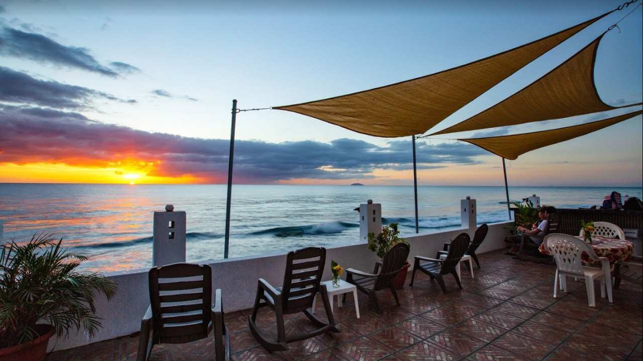 outdoor seating to watch the sunset outside of coconut palm inn