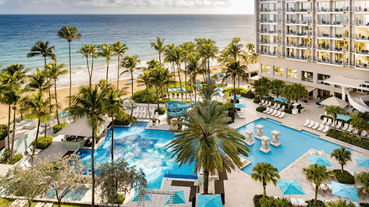 an aerial view of the pool and beach at the hilton waikoloa resort