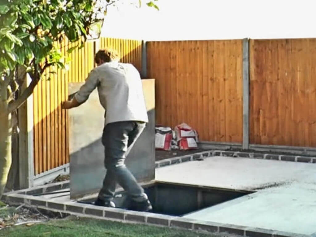Neighbor tears down the fence dividing his property.