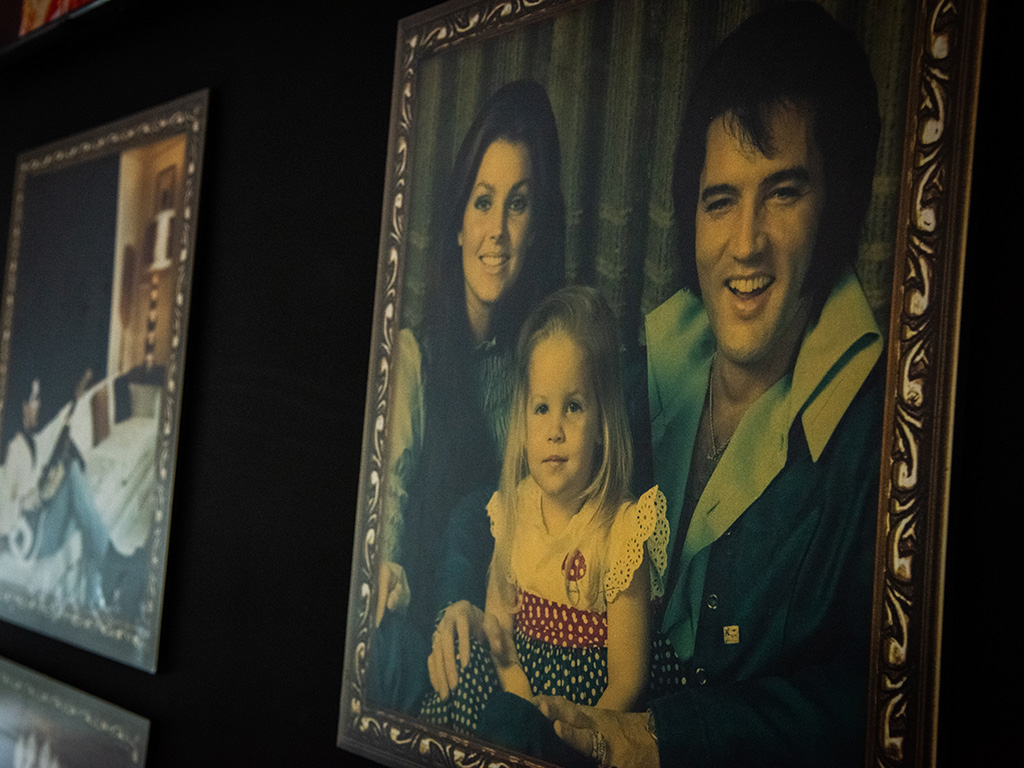 A painting of Elvis Presley, Priscilla Presley and Lisa Marie Presley in the '70s.