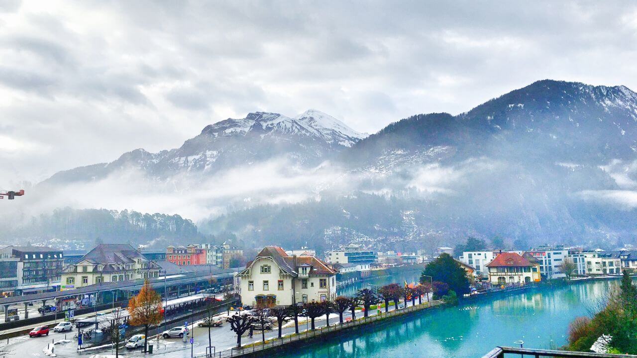 view of interlaken with swiss alps in the background
