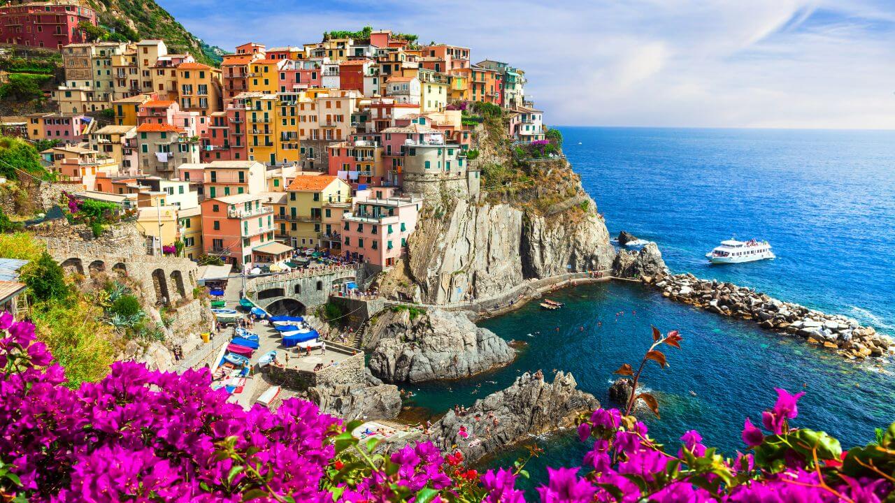 view of manarola in daytime with buildings on cliffs