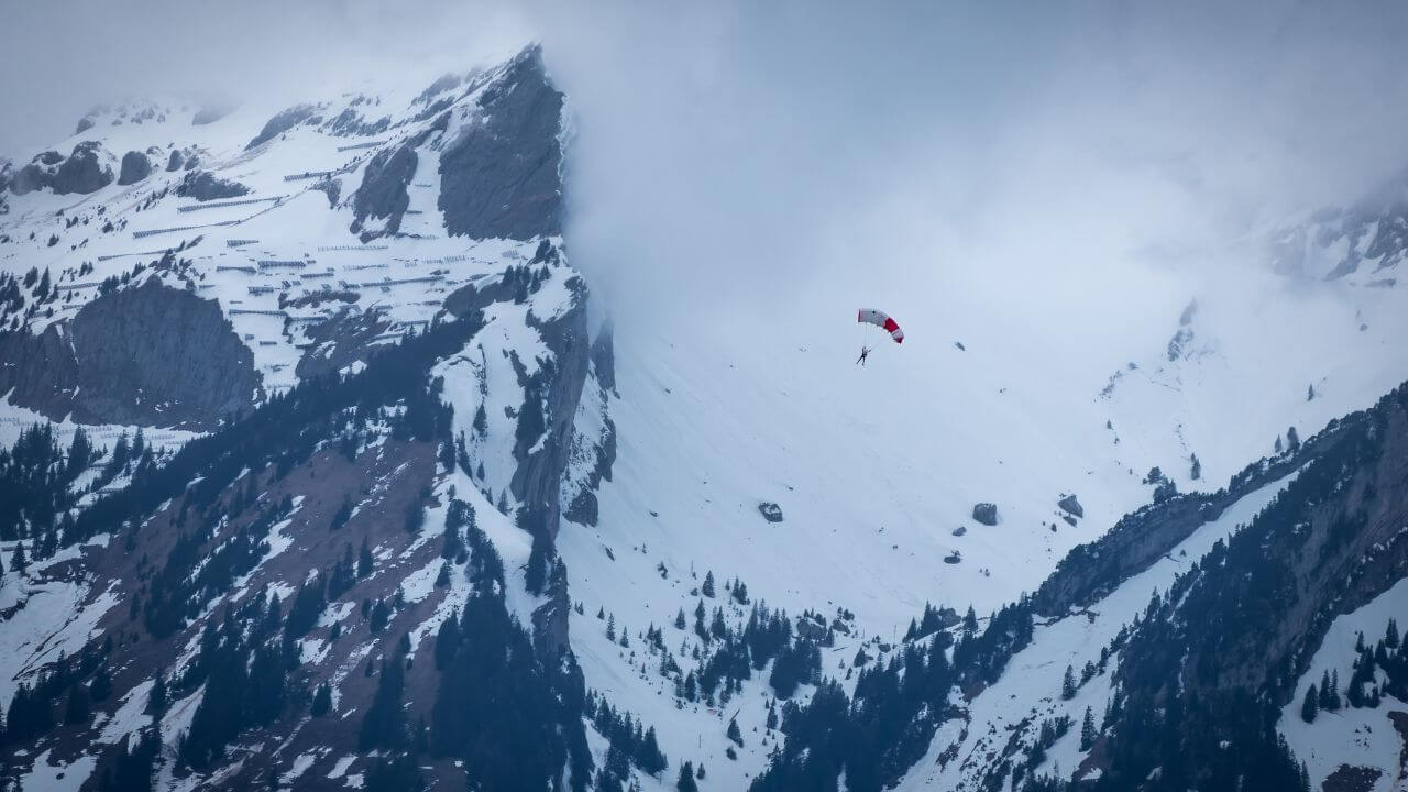 paragliding in the snow in the swiss alps