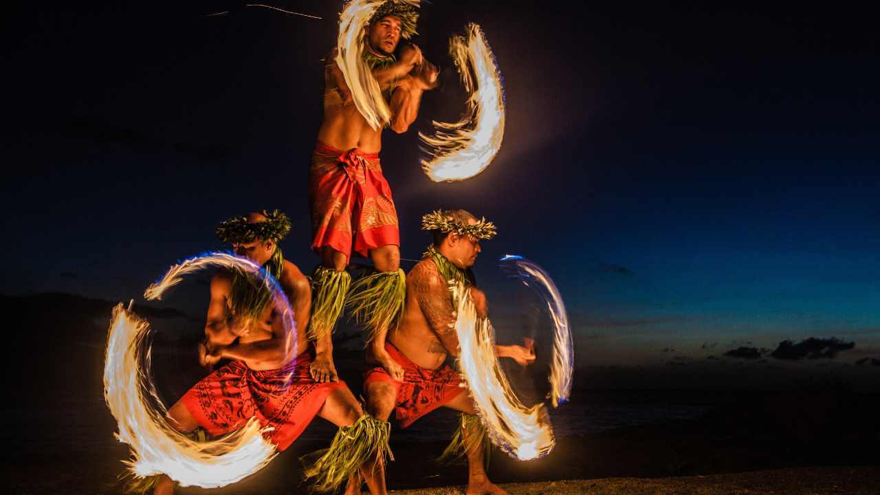 hawaiian fire dancers at night time 