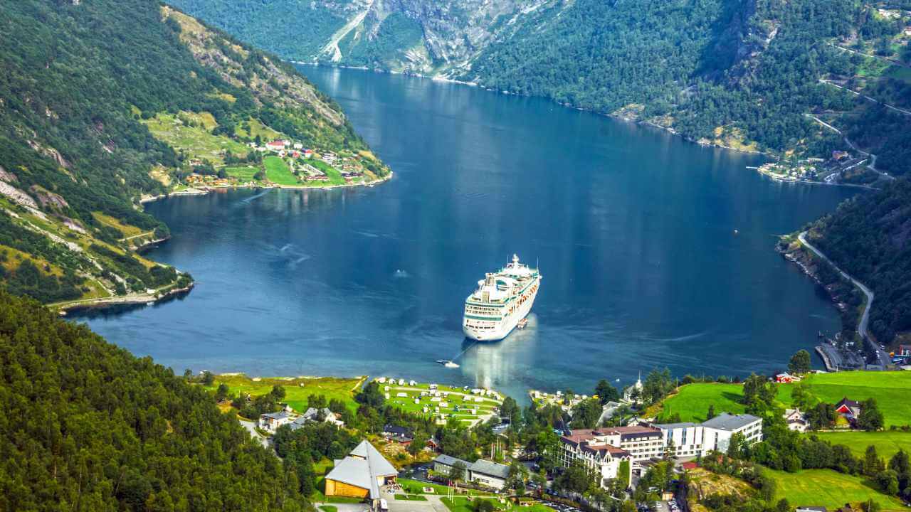 cruise in europe with mountains and water surrounding the ship
