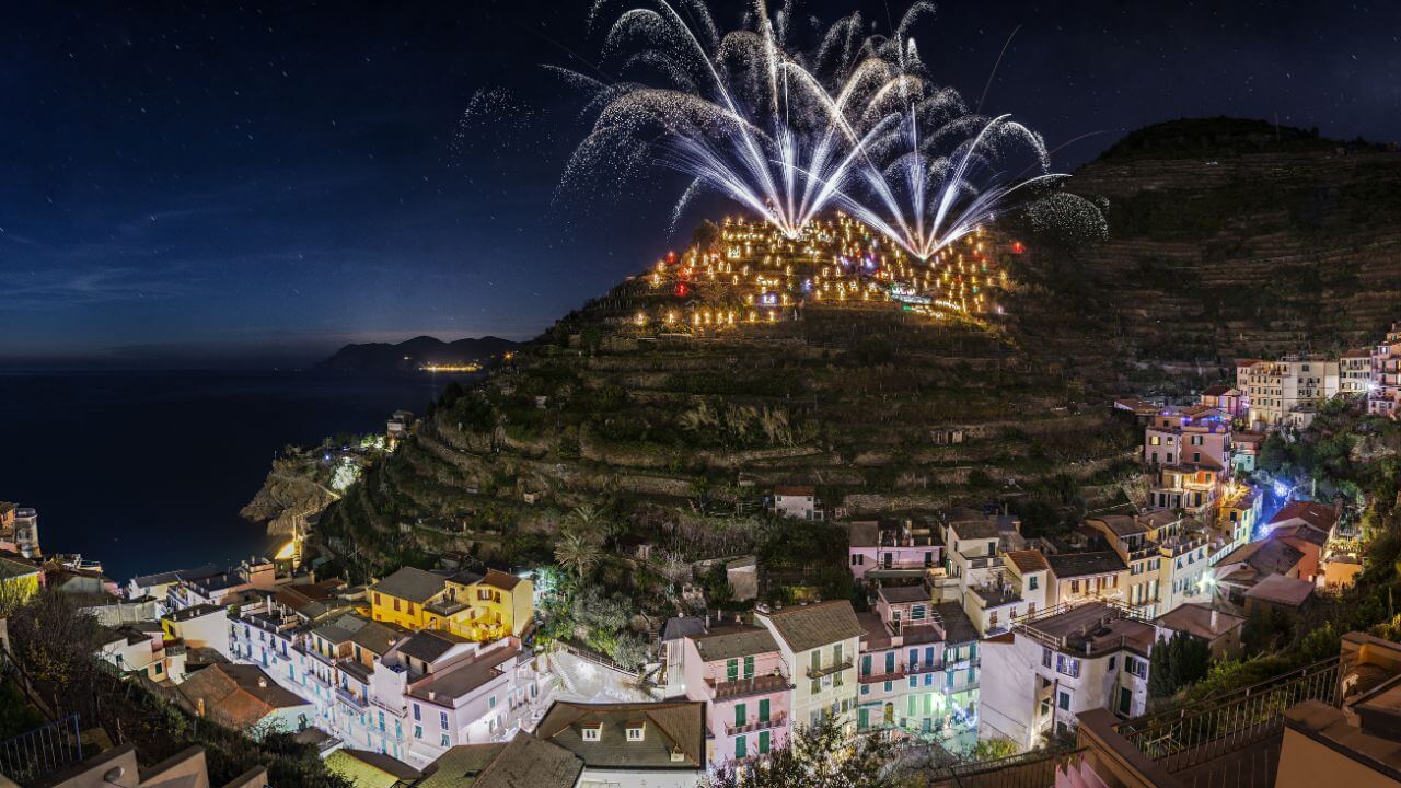 view of nightime firework show in manarola