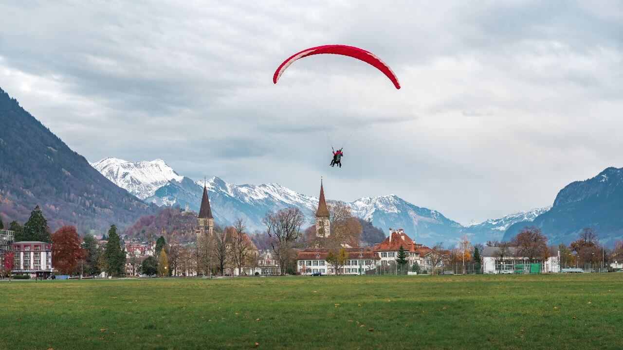 person paragliding over interlaken