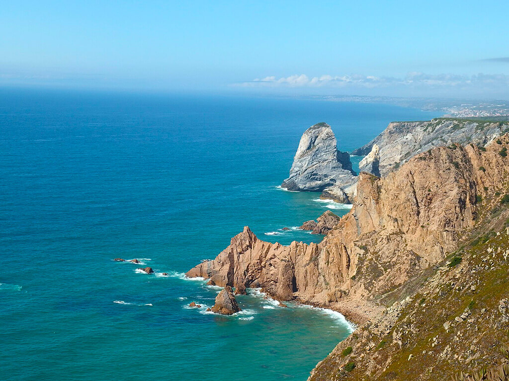 Cabo da Roca (Cape Roca), a cape in Portugal, which forms the westernmost extent of mainland Portugal, continental Europe and the Eurasian land mass.