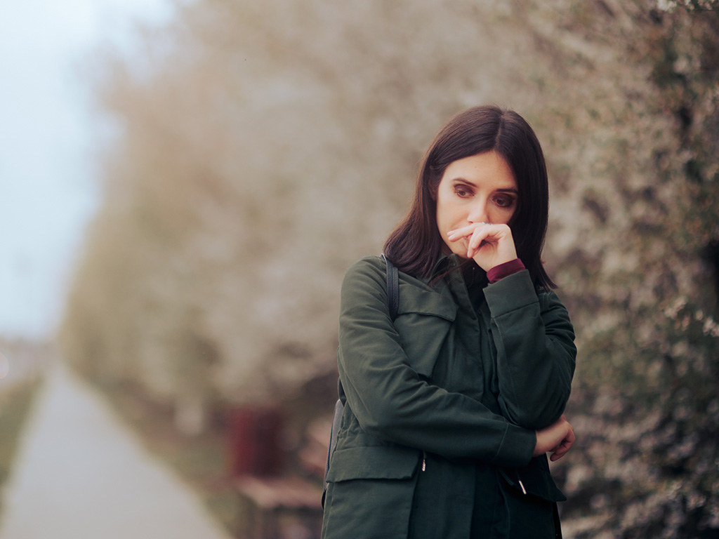 Unhappy Woman Suffering from Seasonal Affective Disorder.