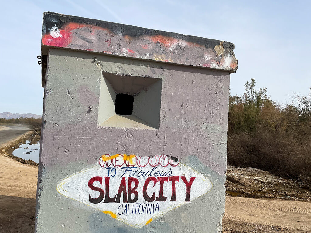 Slab, City, December 27, 2023: The Famous Slab City, California, where an independent community has grown to take over the Dunlap Army Base Site looking at an abandoned Guard point as a Welcome Sign