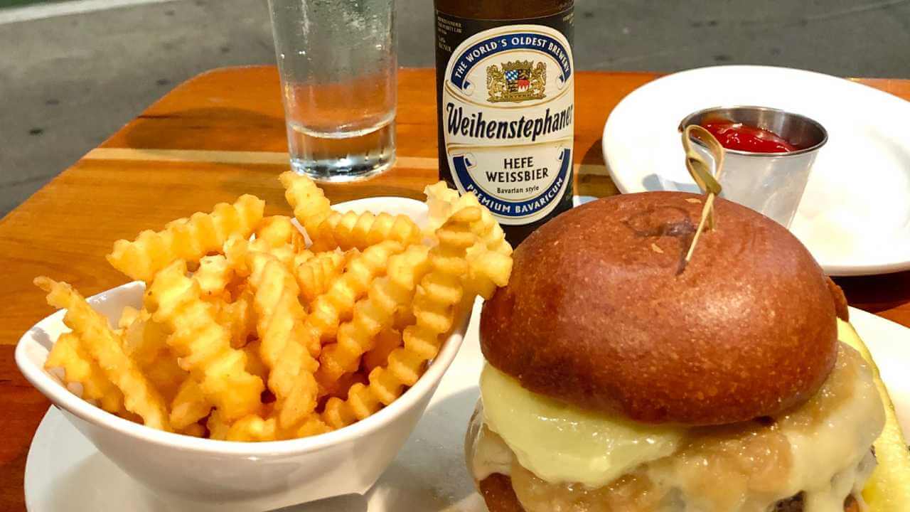 burger fries and beer from 5 napkin burger in hells kitchen