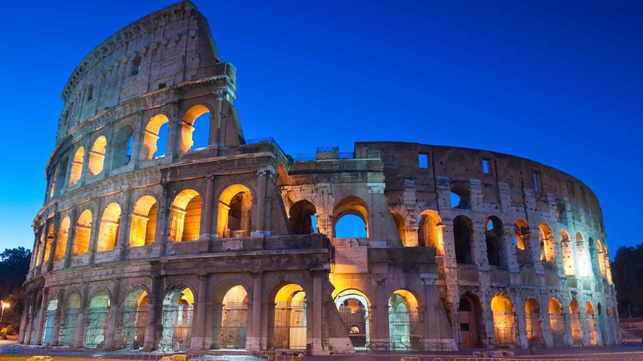 view of colosseum at night time