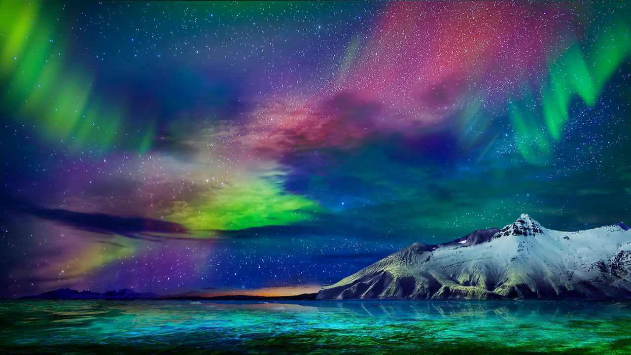 colorful northern lights reflecting above the sky in iceland