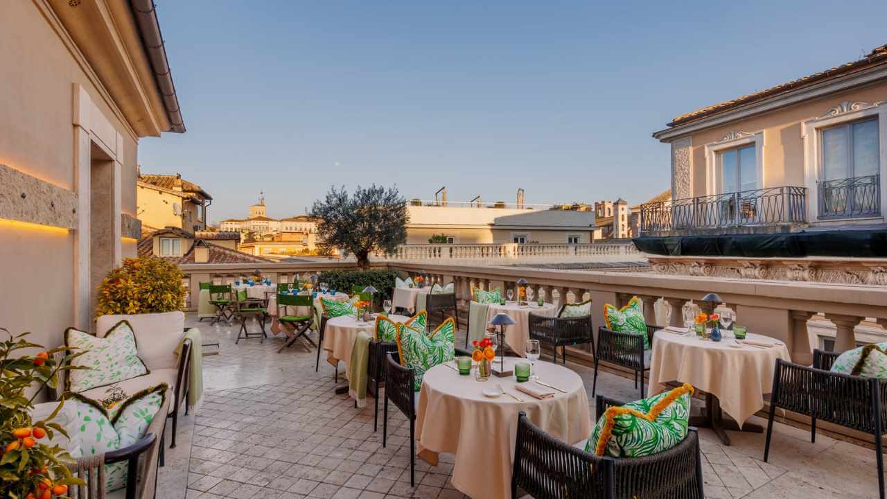 restaurant at singer palace hotel over looking rome cityscape