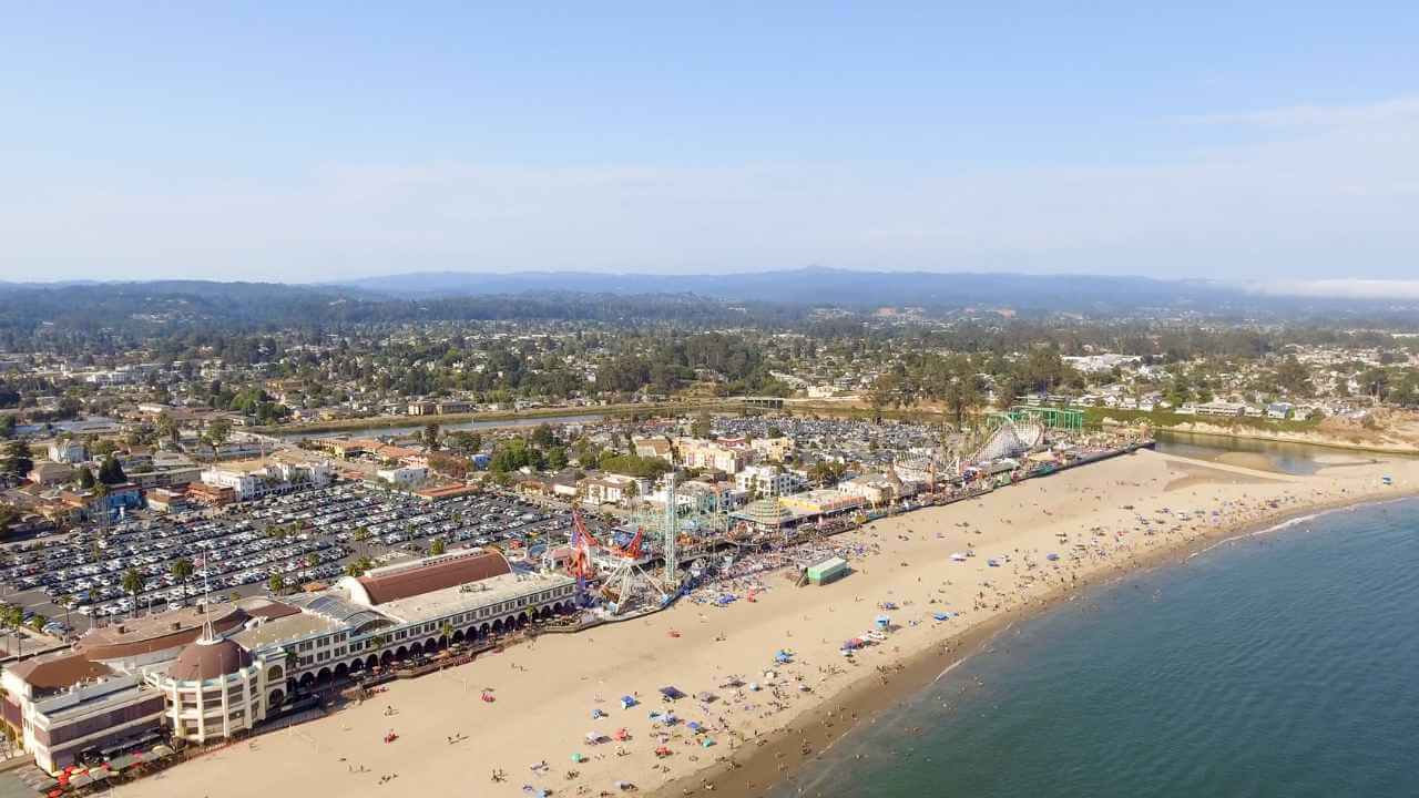 an aerial view of a beach and town