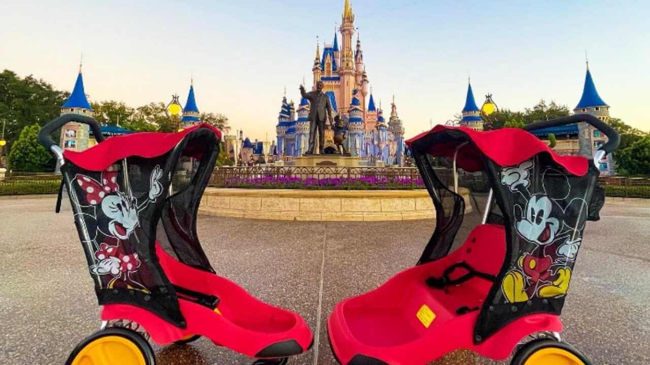 two mickey mouse strollers facing each other in front of cinderlla's castle