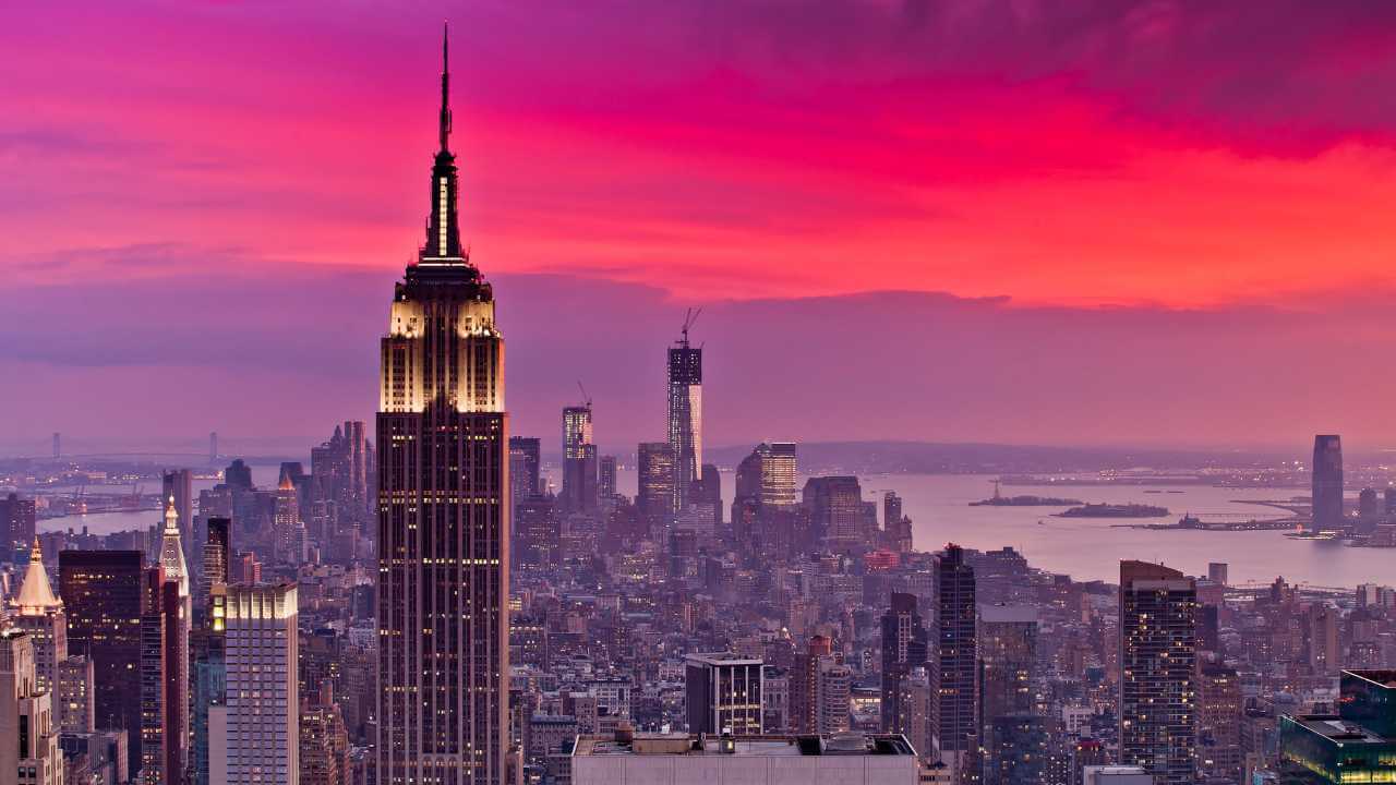 the empire state building in new york city at sunset