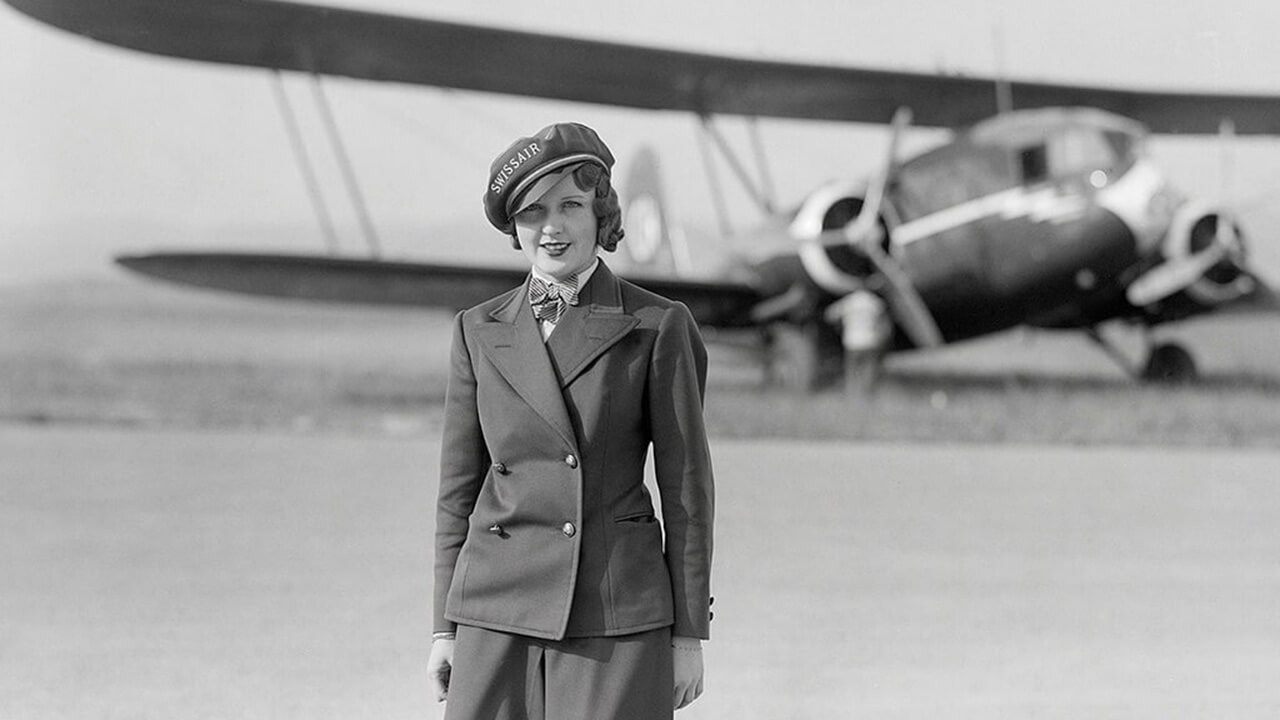 Nelly Diener, the first air stewardess in Europe, standing in front of the Curtiss AT-32C Condor, regn. CH-170, in which she would lose her life on 27 July 1934.
