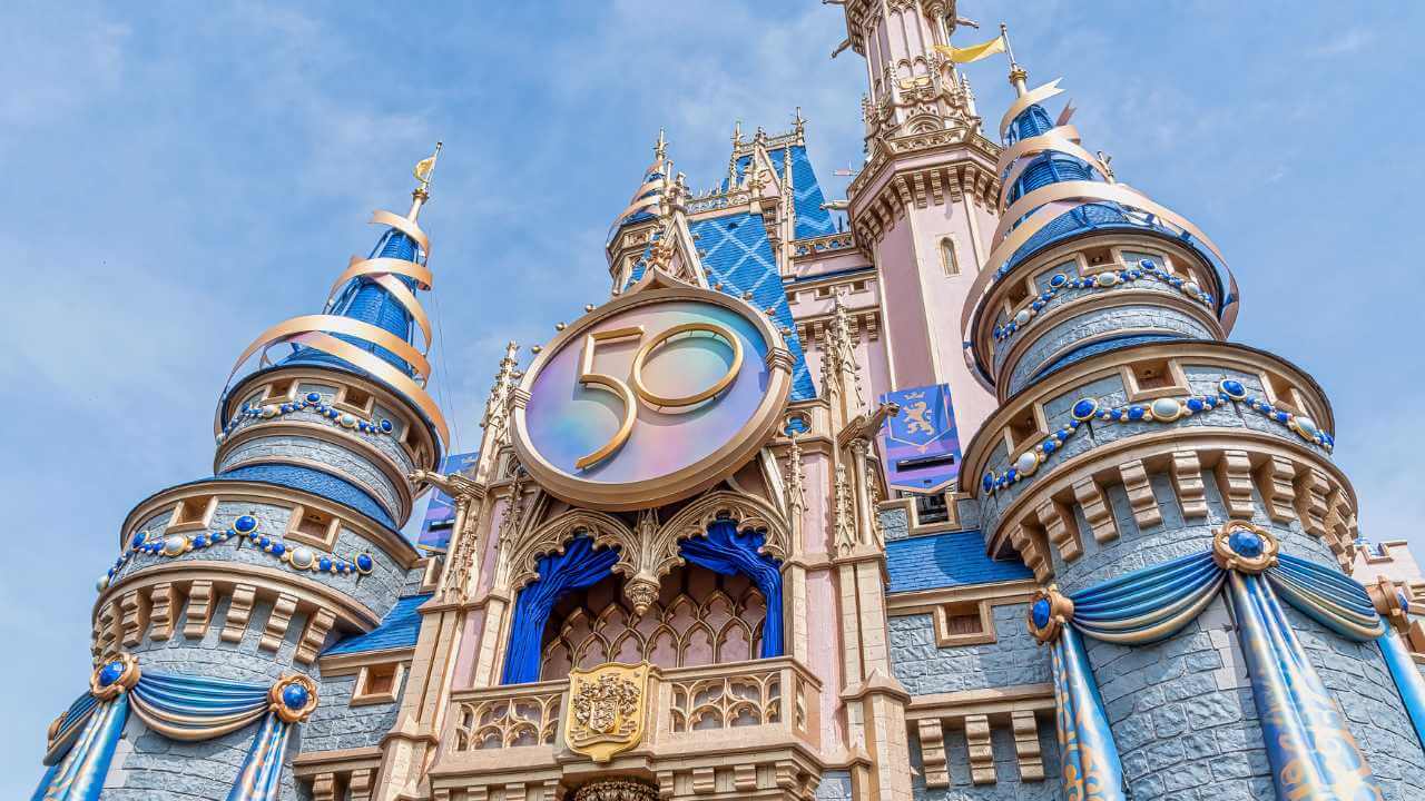 up close view of cinderella's castle with the 50 sign 