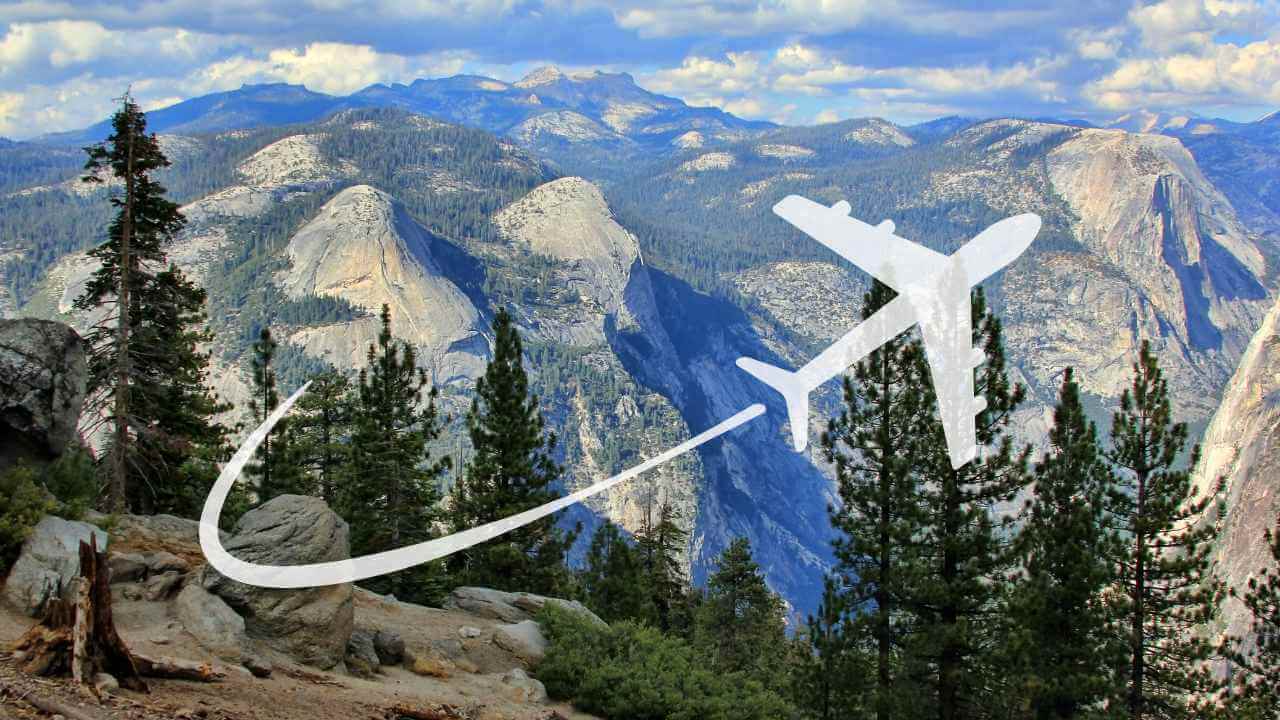 airplane graphic with mountains and trees in background