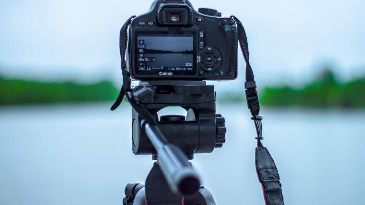 camera on a tripod with a blurred out background