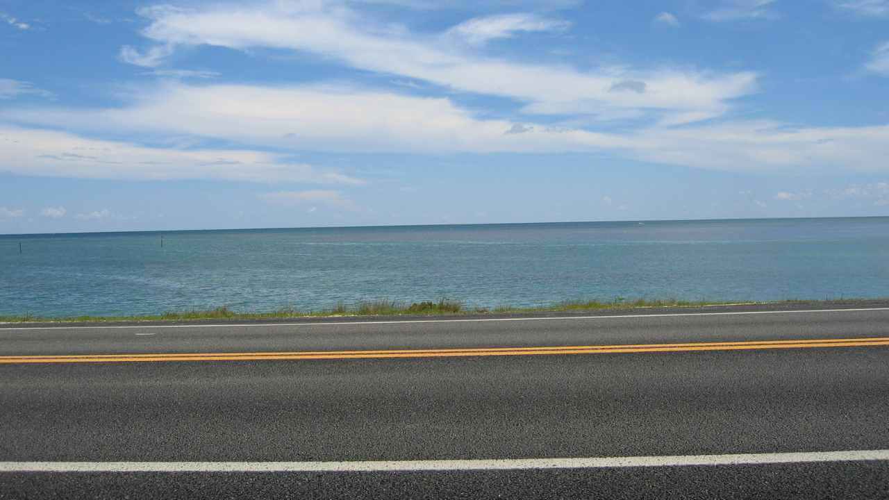 a view of the ocean from a highway