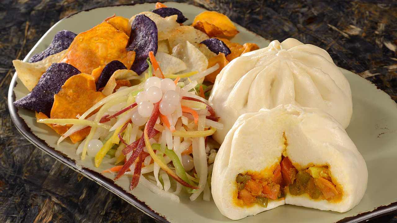 dumplings and a vegetable slaw on a dish